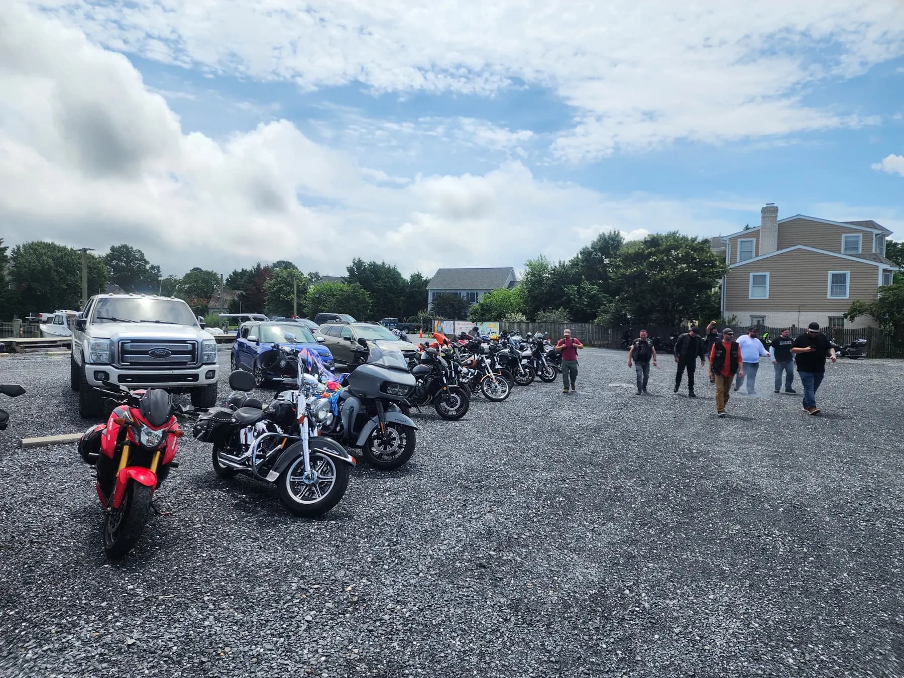 Club motorcycles parked at a waterfront restaurant stop