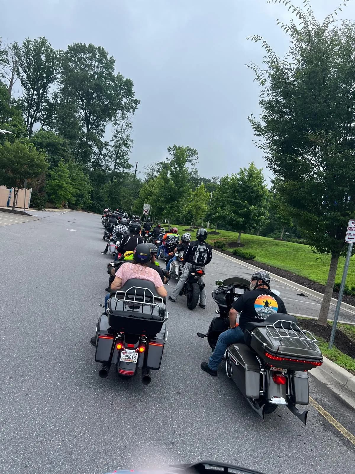 Touring motorcycles leading the group down a tree-lined road